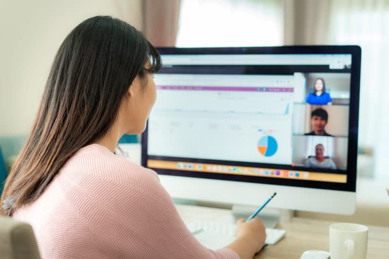 Woman working from home participating in a video conference